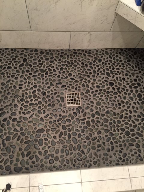 Glazed-Charcoal-Black-Pebble-Tile-Shower-Floor.JPG
